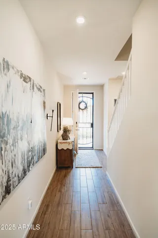a view of a room with wooden floor and closet