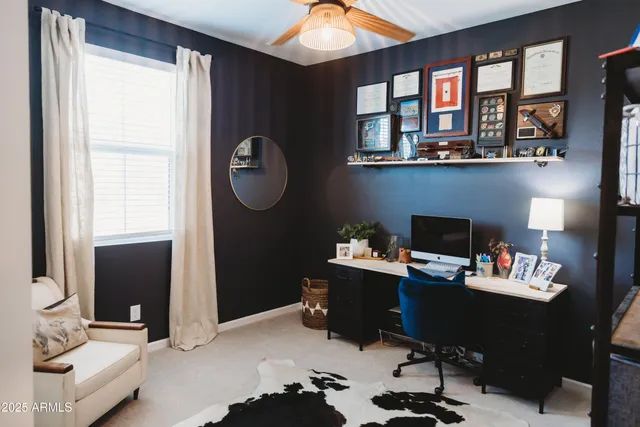 a bathroom with a toilet and a shower curtain