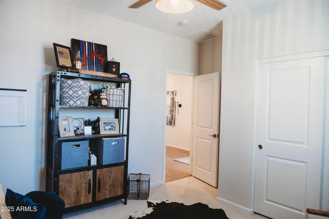 a view of bathroom with a sink and a mirror