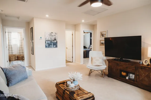 a bedroom with a bed and a flat tv screen