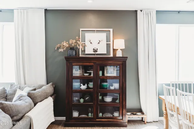 a living room with fireplace furniture and a flat screen tv