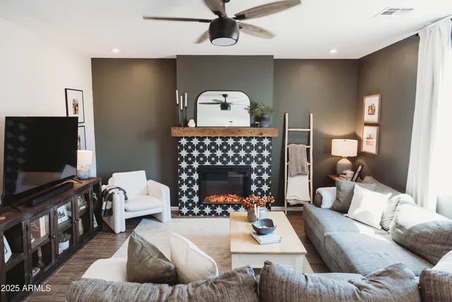 a living room with furniture and a fireplace