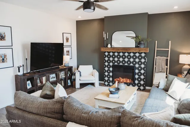 a living room with furniture and a fireplace