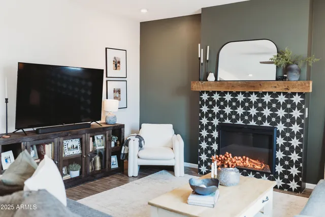 a living room with furniture and a flat screen tv