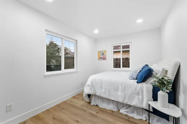 a bedroom with a bed and window