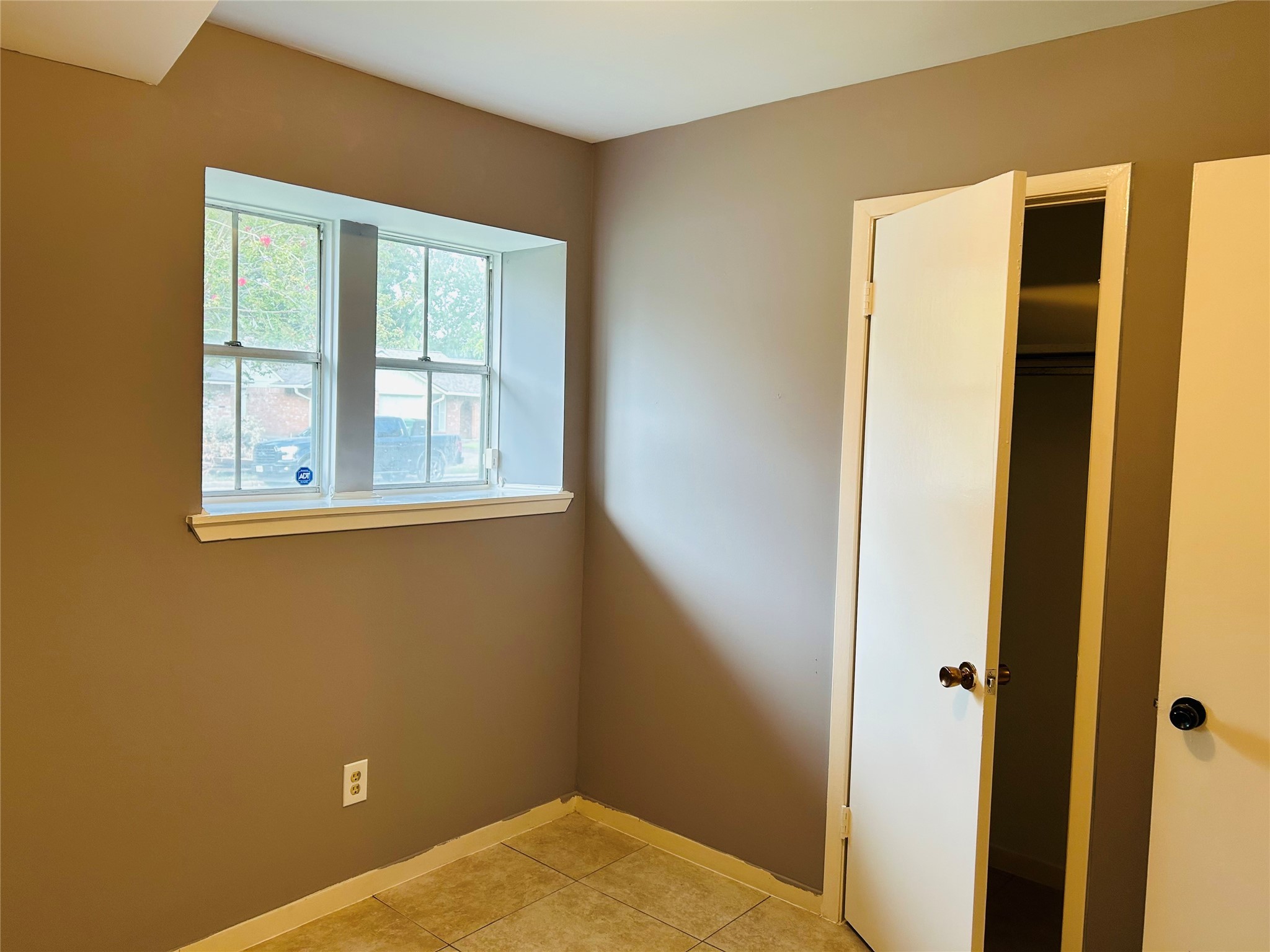 7619 Vernwood Street Houston, TX 77040 - Photo 16 of 25 a view of a small space with wooden floor and a window
