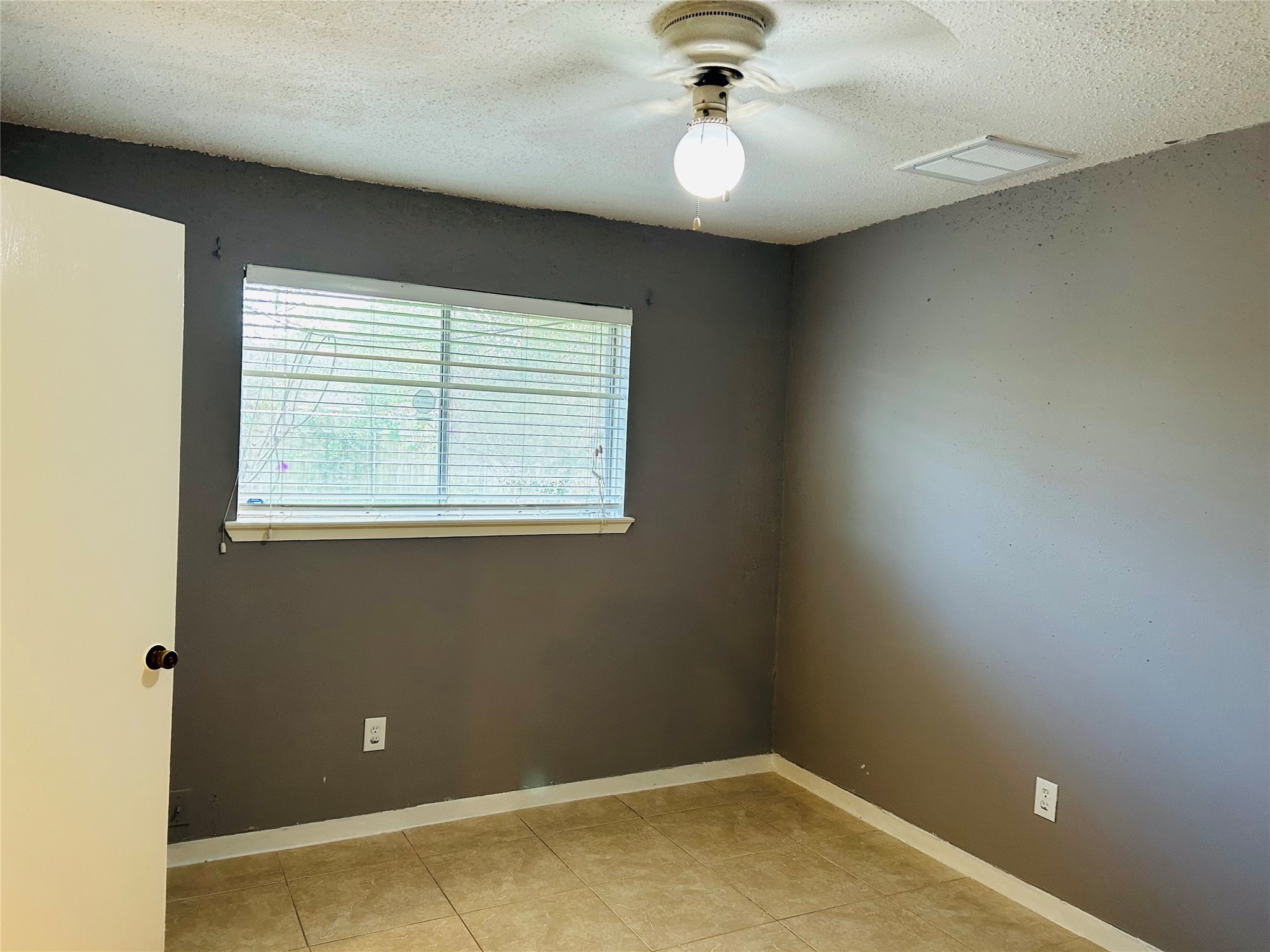 7619 Vernwood Street Houston, TX 77040 - Photo 18 of 25 a view of a livingroom with a window