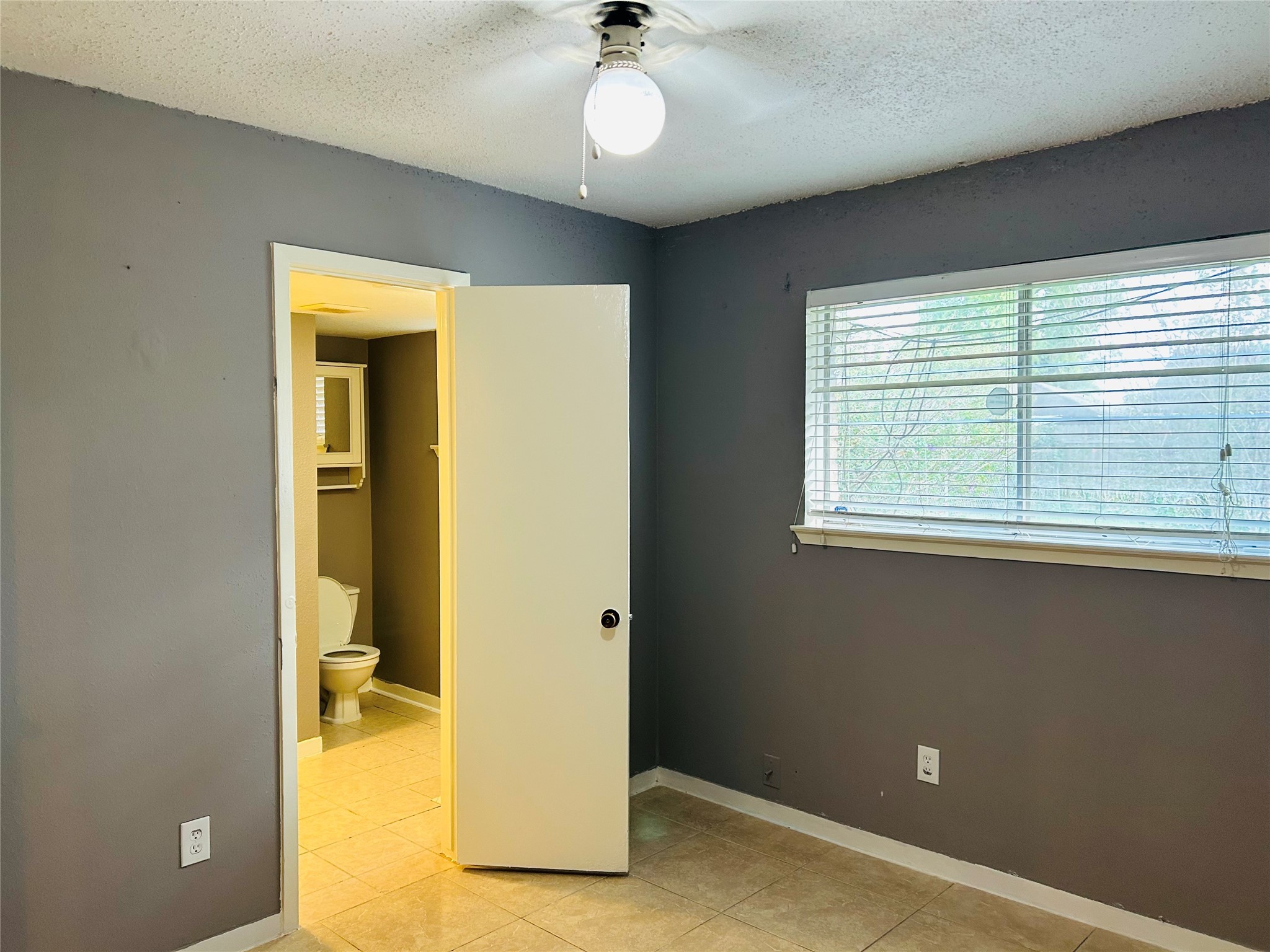 7619 Vernwood Street Houston, TX 77040 - Photo 20 of 25 a view of a hallway with wooden floor and a cabinet
