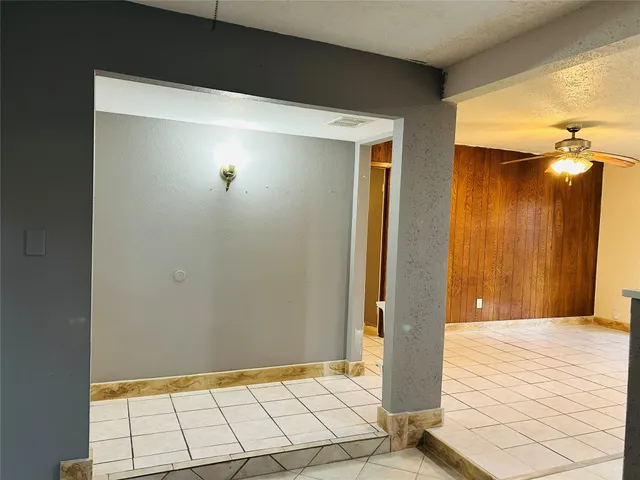 a view of a kitchen with a sink and dishwasher next to a window
