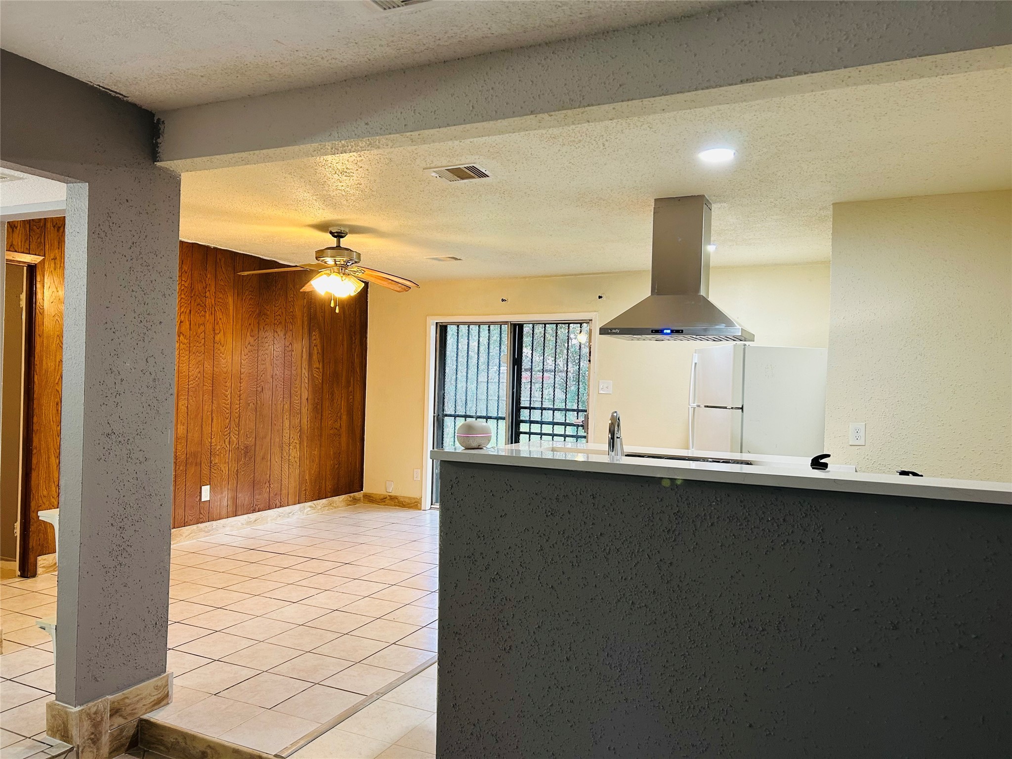 7619 Vernwood Street Houston, TX 77040 - Photo 9 of 25 a view of a kitchen with a sink and dishwasher next to a window