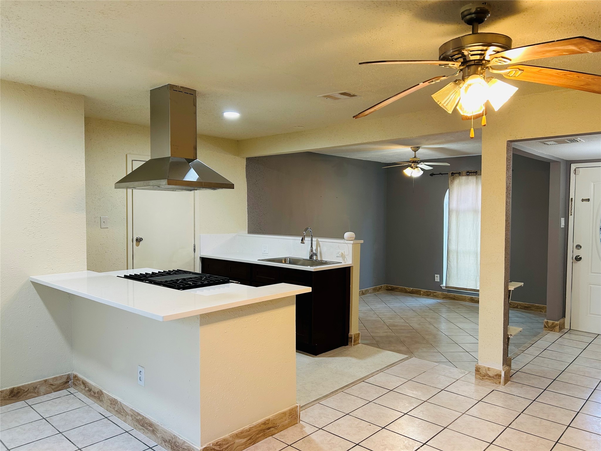 7619 Vernwood Street Houston, TX 77040 - Photo 10 of 25 a kitchen with stainless steel appliances a sink a stove and a refrigerator
