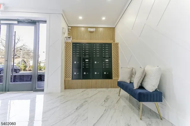 a view of hallway with furniture and a rug