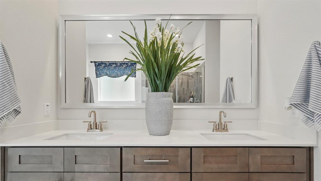 1016 Pitchfork Road Royse City, TX 75189 - Photo 13 of 35 a bathroom with a granite countertop sink a mirror and shower