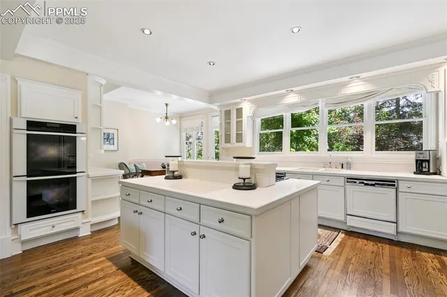 a kitchen with a sink and a stove top oven