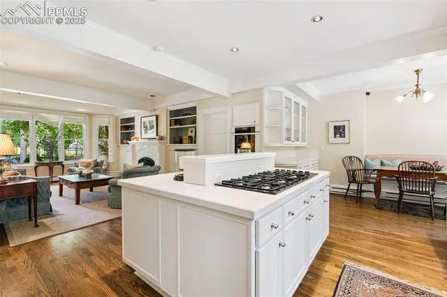 a kitchen with stainless steel appliances granite countertop a stove and a refrigerator
