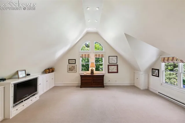 a view of a livingroom with furniture and staircase