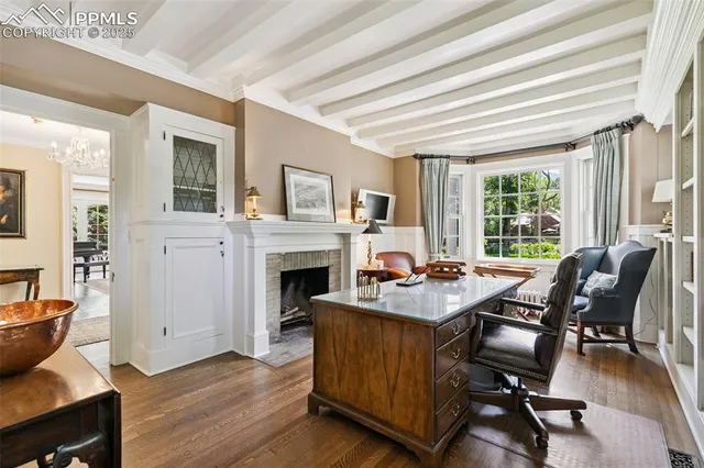 a view of a livingroom with furniture and a fireplace