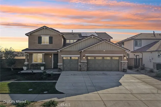 a front view of a house with garage