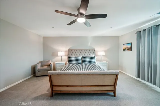 a bedroom with a bed and flat screen tv