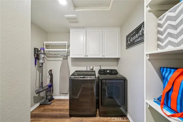 a view of a big house with a big yard and large trees