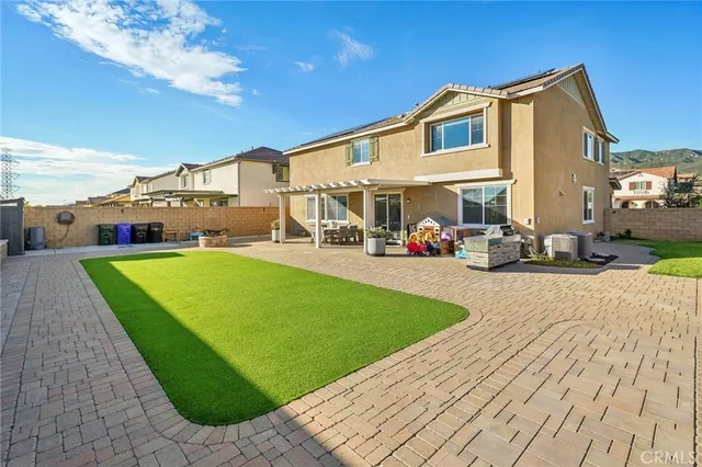 a view of a big house with many windows