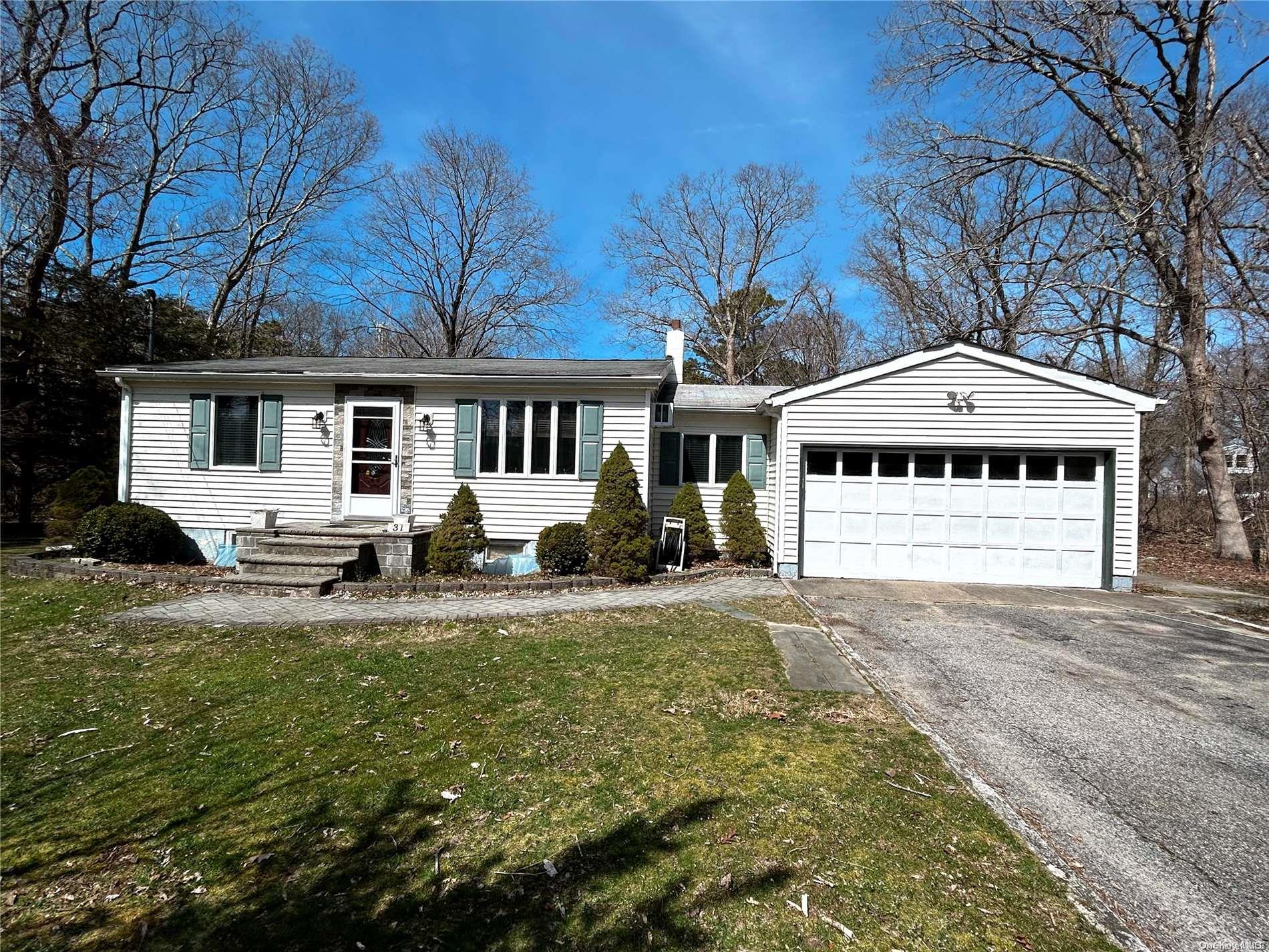 31 Gull Dip Road Ridge, NY 11961 - Photo 1 of 1 a front view of a house with a yard