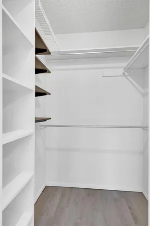 a view of an empty walk in closet