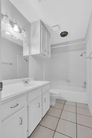 a bathroom with a sink a toilet and bathtub