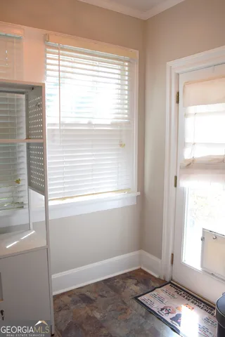 a view of an empty room and window