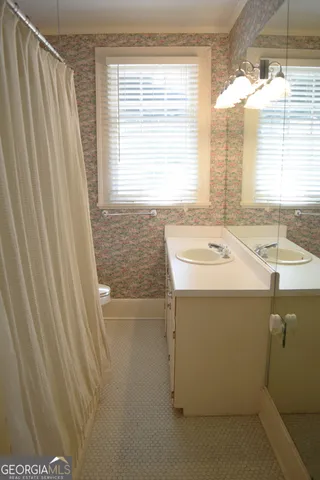 a bathroom with a sink and a bathtub