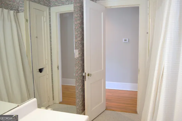 a bathroom with a sink and glass door
