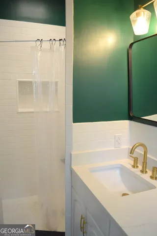 a bathroom with a sink and a mirror