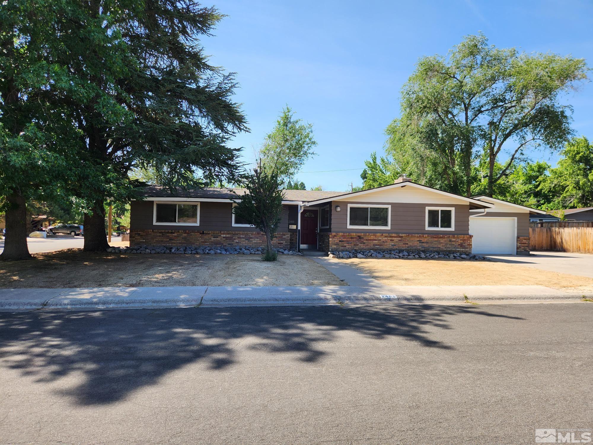 2400 Trentham Way Reno, NV 89509 - Photo 1 of 25 a front view of a house with a yard
