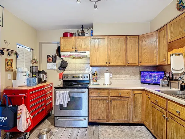 a kitchen with a sink and a stove