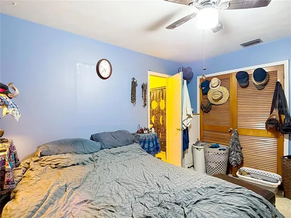 a bathroom with a toilet and shower curtain