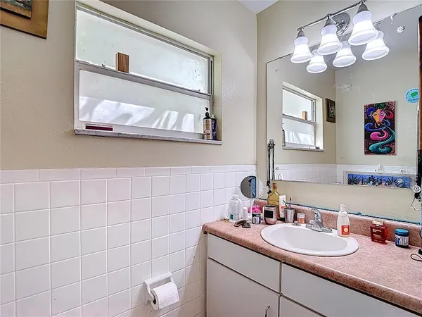 a bedroom with a bed and flat screen tv