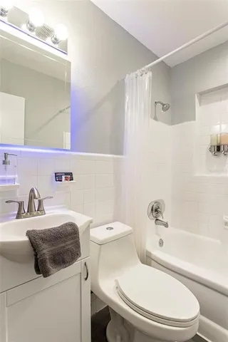 a bathroom with a sink a toilet and a bathtub