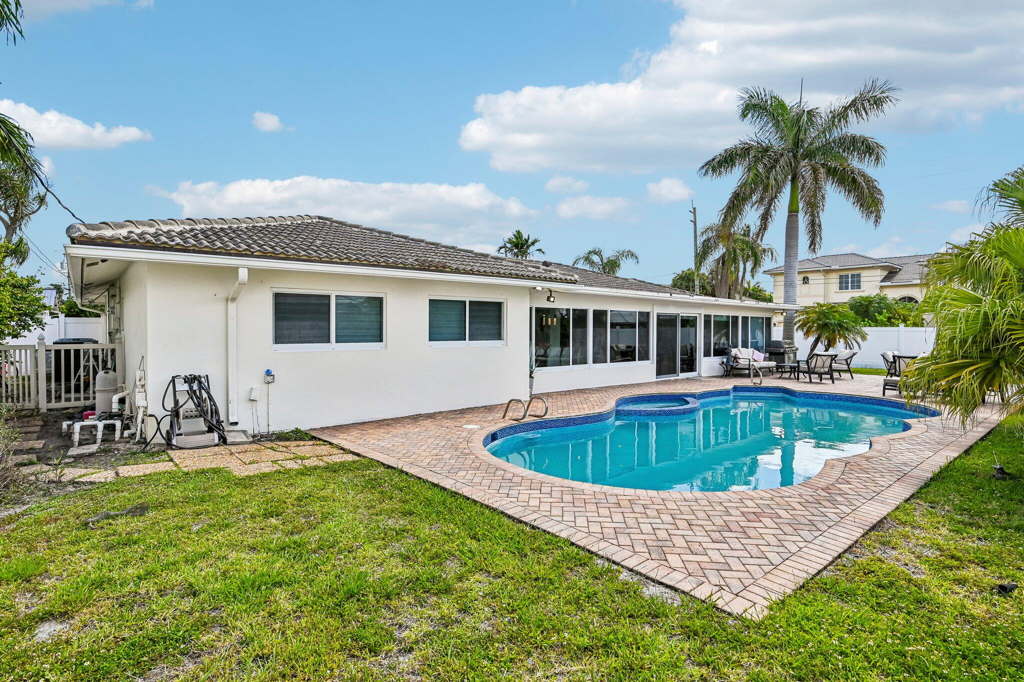 2940 Northeast 39th Court Lighthouse Point, FL 33064 - Photo 29 of 42 a front view of house with yard and swimming pool