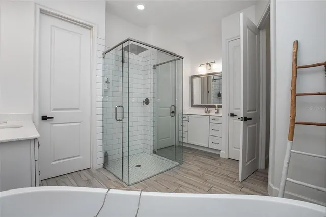 a bathroom with a shower and a sink