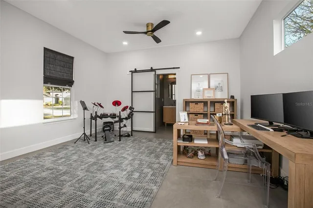 a workspace with furniture and window