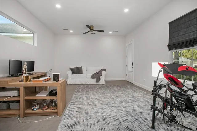 a view of a workspace with furniture and a flat screen tv