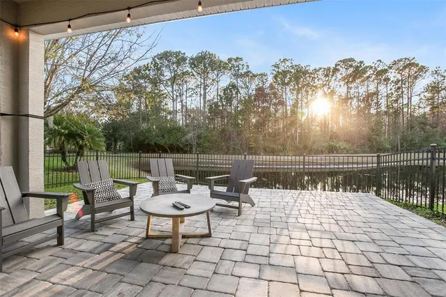 a view of a lake with furniture
