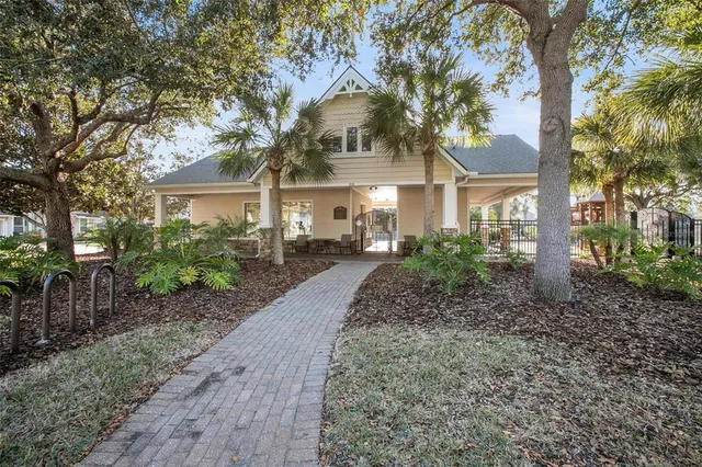 a room with gym equipment and large windows