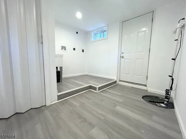 a view of a house with wooden fence