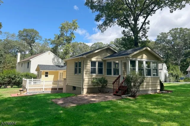 a view of lake with boats and trees around