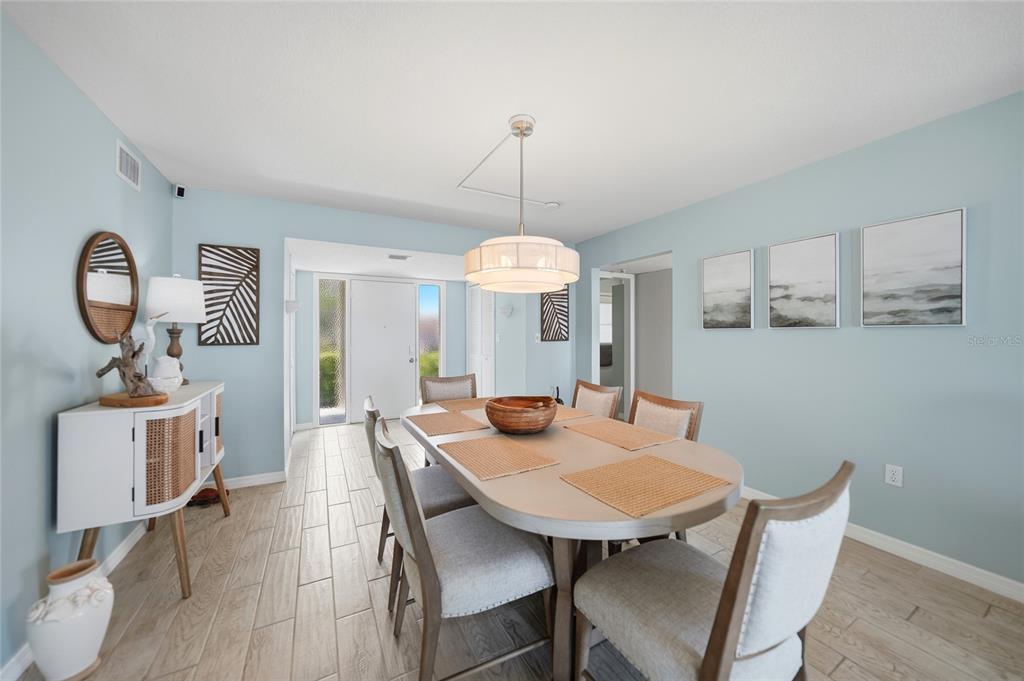 1 Colony Point Drive, Unit A10 Punta Gorda, FL 33950 - Photo 14 of 31 a view of a dining room with a table and chairs