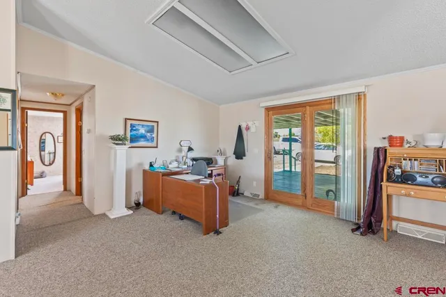 a view of room with furniture and a large window