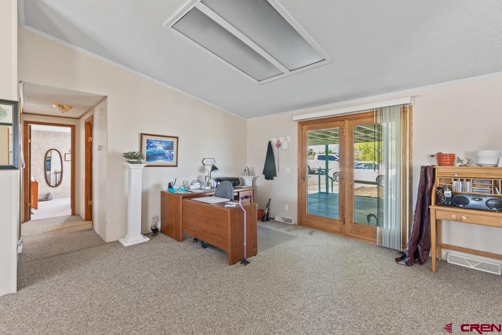 7655 6075th Road Olathe, CO 81425 - Photo 14 of 24 a view of room with furniture and a large window