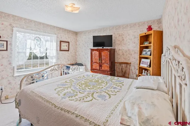 a living room with a flat screen tv and a couch