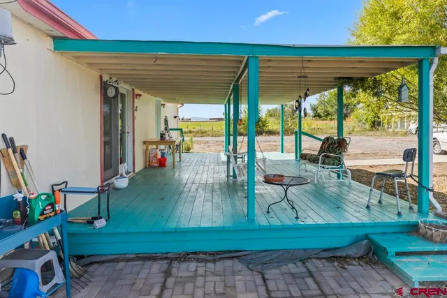 a living room with patio furniture